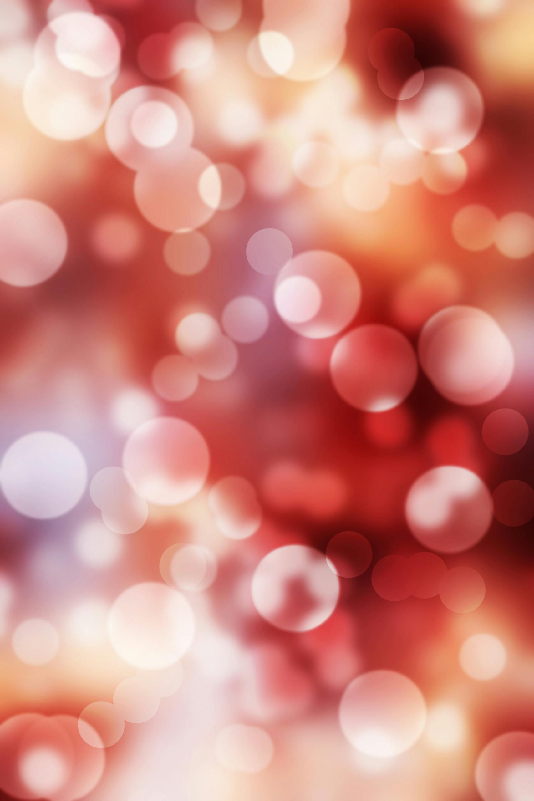 A dynamic red bokeh background with bright circles and blurred patterns.